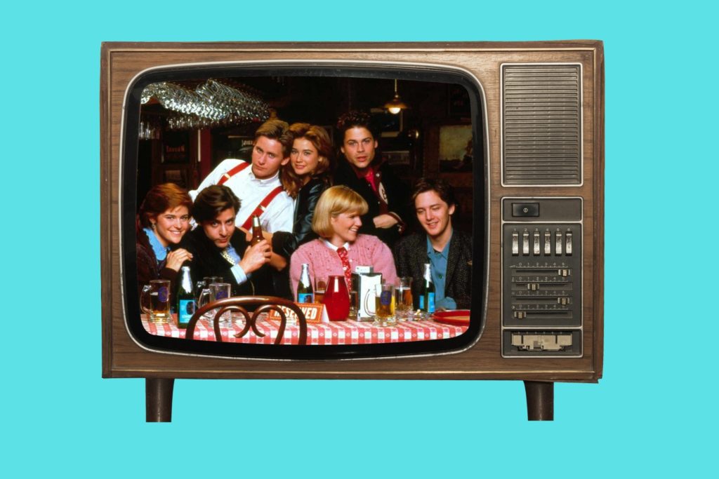1980s Brat Pack movie posters in cinema room The Breakfast Club detention scene St Elmo’s Fire cast group image Molly Ringwald in Pretty in Pink Andrew McCarthy Brats documentary still John Hughes directing 1980s teen movie classic Brat Pack actors together 1980s teen cinema VHS collection