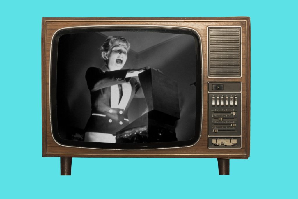 Found footage horror films displayed in atmospheric cinema room