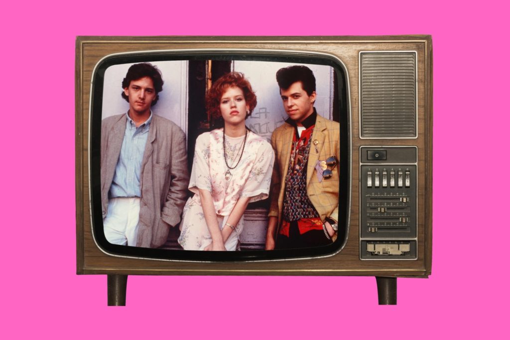1980s Brat Pack movie posters in cinema room The Breakfast Club detention scene St Elmo’s Fire cast group image Molly Ringwald in Pretty in Pink Andrew McCarthy Brats documentary still John Hughes directing 1980s teen movie classic Brat Pack actors together 1980s teen cinema VHS collection